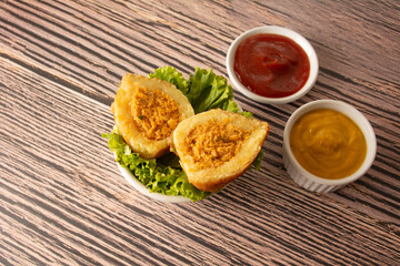 Crispy Fried Chicken Ball (Brazilian Coxinha de Frango) and condiments, top view
