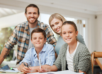 Succeeding as a team. Shot of a young family doing homework together at home.