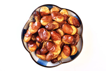 Roasted salted broad bean whith shell on white background           