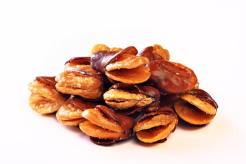 Roasted salted broad bean whith shell on white background           