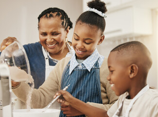 We can never add too much. Shot of a grandmother baking with her two grandkids at home. - obrazy, fototapety, plakaty