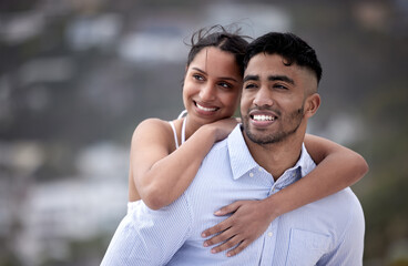 Modern day romance. Cropped shot of a handsome young man piggybacking his girlfriend along the beach.