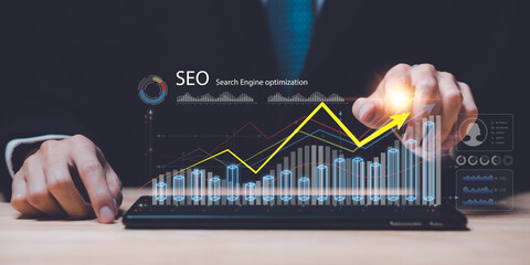 Marketer showing SEO concept,optimization analysis tools, search engine rankings, social media sites based on results analysis data,Website Search Optimization ,Interesting web rankings from visitors