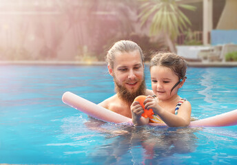 Dad and child playing in the water