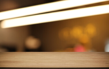 Empty wooden table in front of abstract blurred background of coffee shop . can be used for display or montage your products.Mock up for display of product