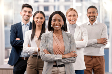 Obraz premium Youll never meet a better team. Shot of a group of businesspeople together in their office.