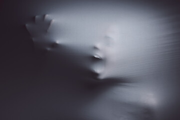 There is no black-and-white definition of normal. Shot of a scary figure confined under a sheet.
