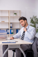 Young male employee working in the office