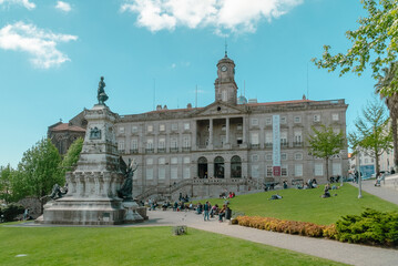 Oporto, Portugal. April 13, 2022: Stock Exchange Palace and Don Henrique Statue.