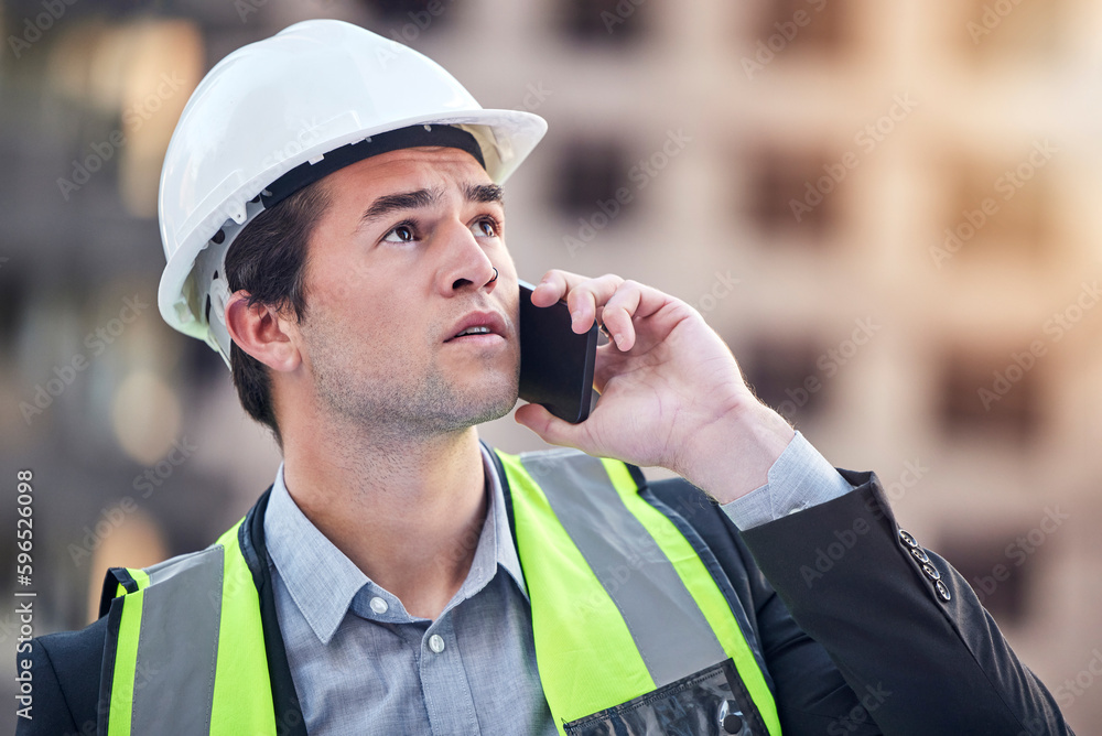 Poster its on the way up. cropped shot of a handsome male construction worker making a call while standing 