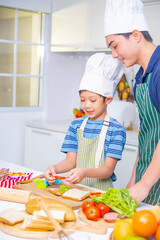 father and son cooking