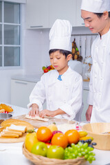father and son cooking