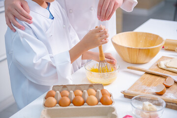 father and son cooking