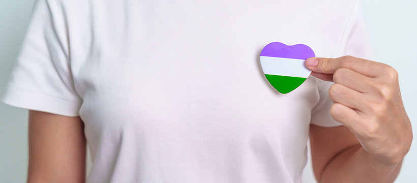 Queer Pride Day and LGBT pride month concept. purple, white and green heart shape for Lesbian, Gay, Bisexual, Transgender, genderqueer and Pansexual community
