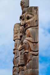 First Nations totem poles close up of Gitxsan natives in Gitanyow or Kitwancool, British Columbia,...