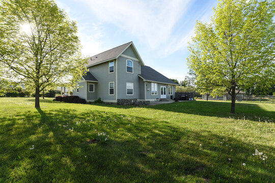 Farmhouse Backyard with Trees