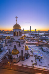 Winter Yekaterinburg and Temple on Blood in beautiful blue clear sunset. Aerial view of Yekaterinburg, Russia. Translation of the text on the temple: Honest to the Lord is the death of His saints.