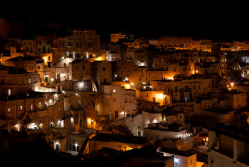 Matera, Italy. Amazing view of the Sassi of Matera at night. Landscape of the historical part of the town. An Unesco World Heritage Site. Touristic destination