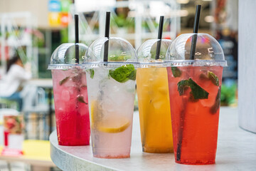 summer drinks in the plastic cups