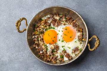 From traditional Turkish cuisine; fried eggs with meat. Turkish name; kavurmali yumurta