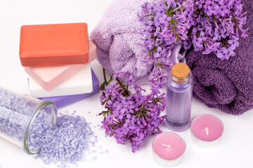 Lilac flower soap and essential oil, spa concept.