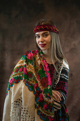 Ukrainian woman wear traditional ethnic clothes - embroidered shirts and handkerchief