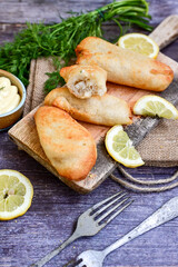   Allasca Pollock Fish  Bites in a crispy Tempura  Batter.Fish and chips .Close up of   crispy breaded  deep fried fish fingers with breadcrumbs s erved with remoulade sauce and  lemon