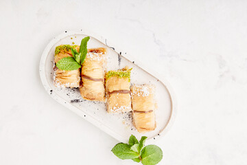 One of the most beautiful desserts of Turkish cuisine - baklava with pistachio. Traditional turkish dessert baklava.