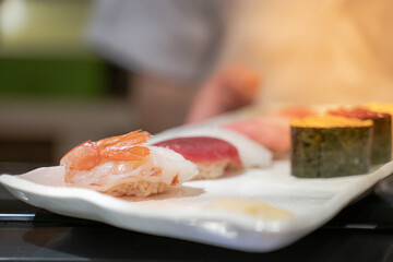 sushi japan is traditional Asian food the ingredients include rice with raw fish sweet eggs seaweed salmon uni tuna all are good and fresh, the closeup of Japan fresh national dish.