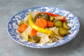 Assorted mixed pickled vegetables in bowl - plate, Turkish name; tursu.