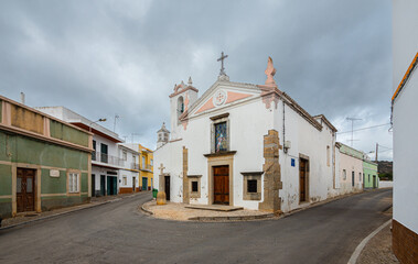 Street with church in the village of Estoi, Portugal
