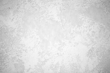 Light background of decorative plaster with abstract spots. Unusual texture of white or gray wall with beautiful patterns, creative surface background. Finishing coating for building cladding.