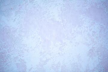 Gray background of decorative plaster with abstract spots. Unusual silver wall texture with beautiful patterns, creative surface background. Dressing coating for building cladding.