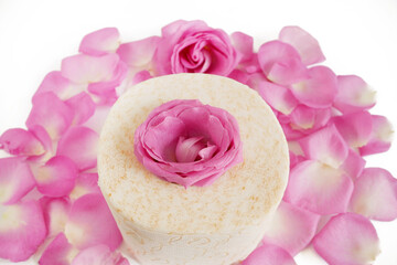 Toilet papers and pink rose flowers with petals on white background, Toilet paper with a smell concept, flat lay