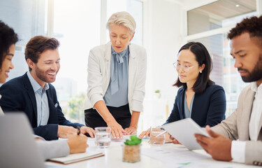 Collaboration, meeting and a manager business woman talking to her team in the boardroom for...