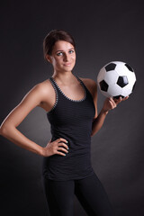 young woman with soccer ball