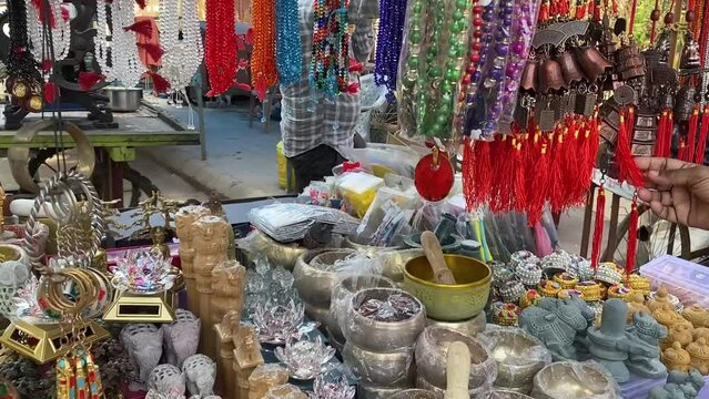 Souvenir, key chains, gift items and Buddha statues sold in local market near monastery in Gaya, Bihar.