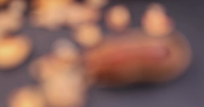 focus on closed long ripe tamarind pods close-up, ready-to-eat tamarind fruits lying on the table