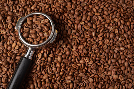 Espresso Portafilter on arabica coffee bean