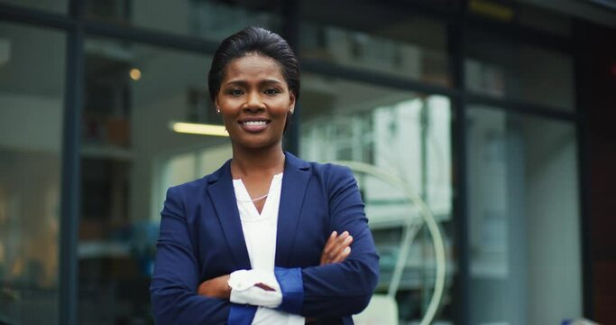 Face, business and black woman with arms crossed in city with pride for career or job in urban street. Portrait, professional and happy, proud and confident African female entrepreneur from Nigeria.