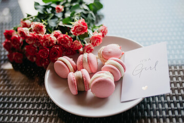 Pink macaroons in a cafe. Gender party is a girl