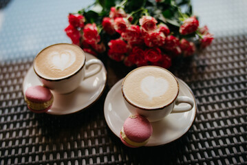 A romantic date on Valentine's Day. Coffee with hearts and flowers