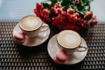A romantic date on Valentine's Day. Coffee with hearts and flowers