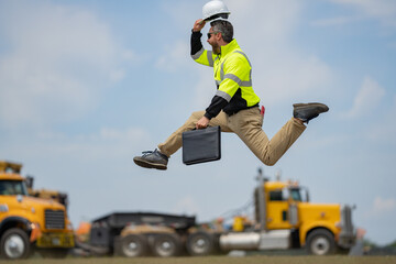 Fast building. Funny construction worker jumping. Excited jump of builders run in helmet. Worker in...