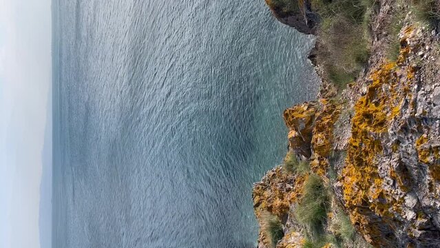 top view of the rocky sea shore - Vertical stock video