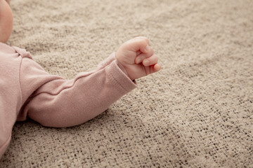 Cutle little newborn babies hand, clenched in a fist.