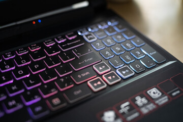 Obraz premium Color backlit keyboard close up. Gaming laptop.