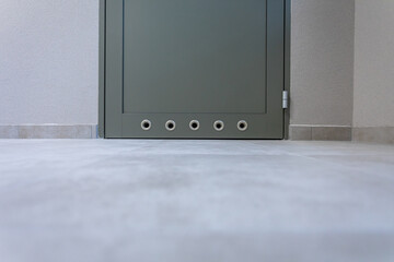 Doors to a locker room or bathroom with bottom ventilation.
