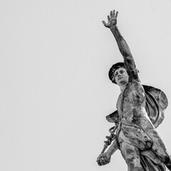 Ancient statue of antique god of commerce, business, merchants and travelers Hermes (Mercury). He...