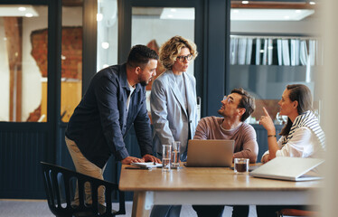 Business people having a meeting in a digital marketing agency - obrazy, fototapety, plakaty